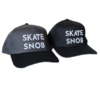 SKATE SNOB Branded Baseball Caps (Snapbacks) One is black with white raised embroidery. The other is grey/black bib with white raised embroidery.